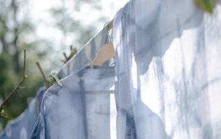 Cotton shirting fabric on loom, illustrating shrinkage control in bulk production